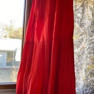 Pleated orange maxi skirt